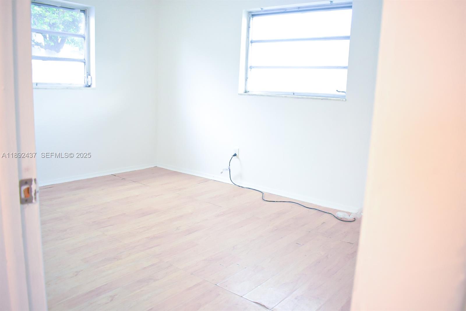 2265 Northwest 98th Street, Unit 2265 Miami, FL 33147 - Photo 5 of 15 a view of a room with a window