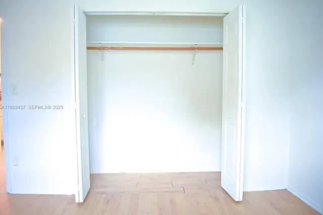 a picture of door with a white wall