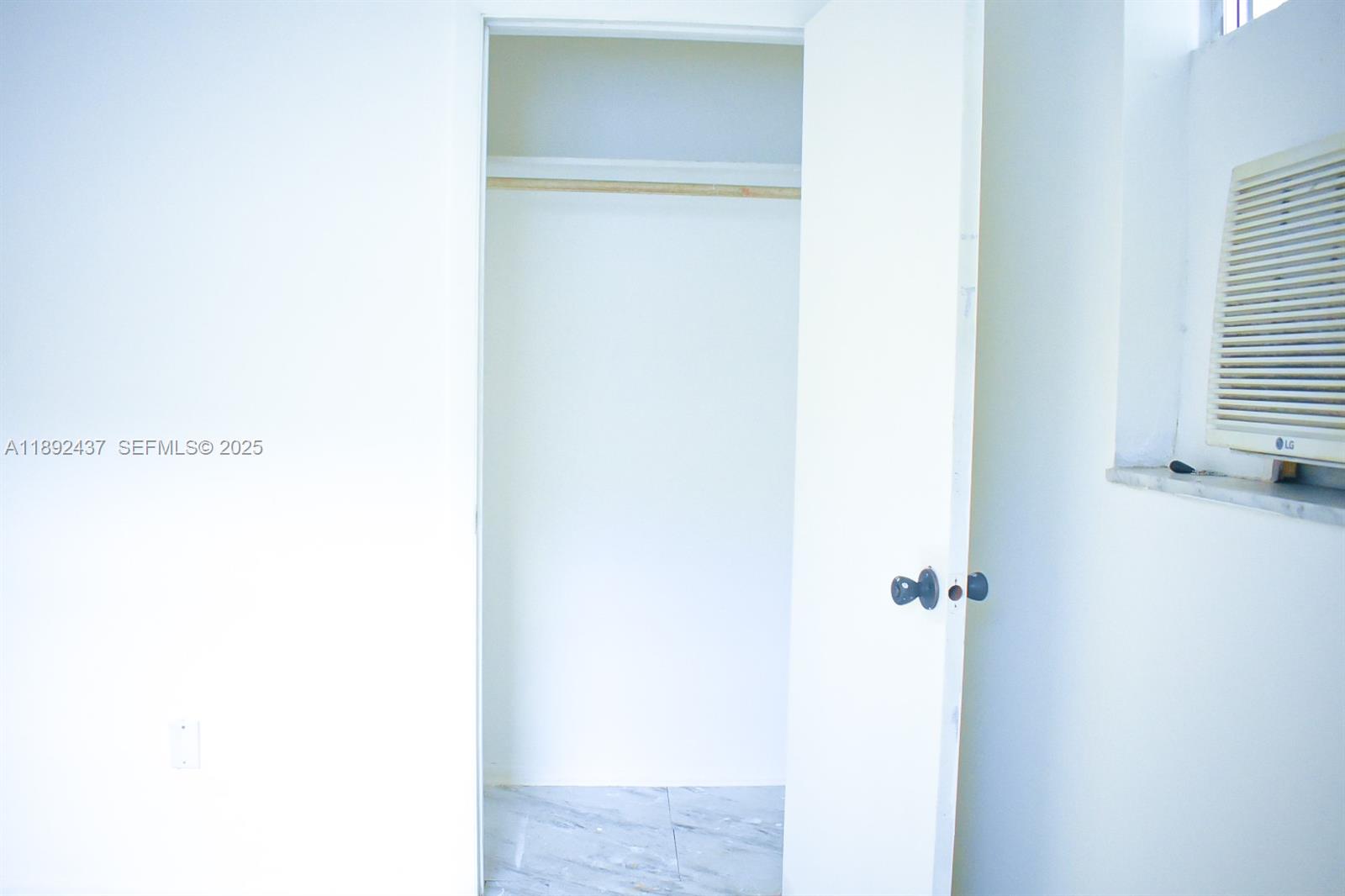 2265 Northwest 98th Street, Unit 2265 Miami, FL 33147 - Photo 10 of 15 a picture of door with a white wall