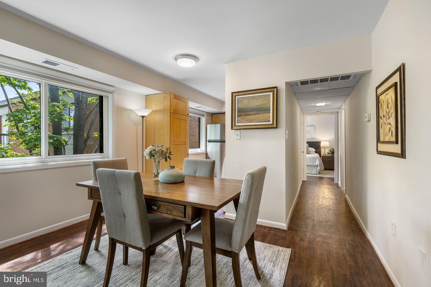a view of a dining room with furniture and wooden floor