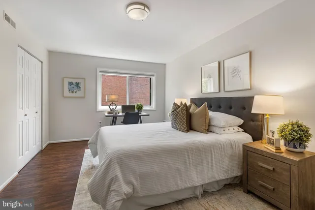 a bedroom with a bed and window