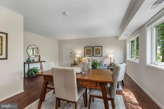 a view of a dining room with furniture and window