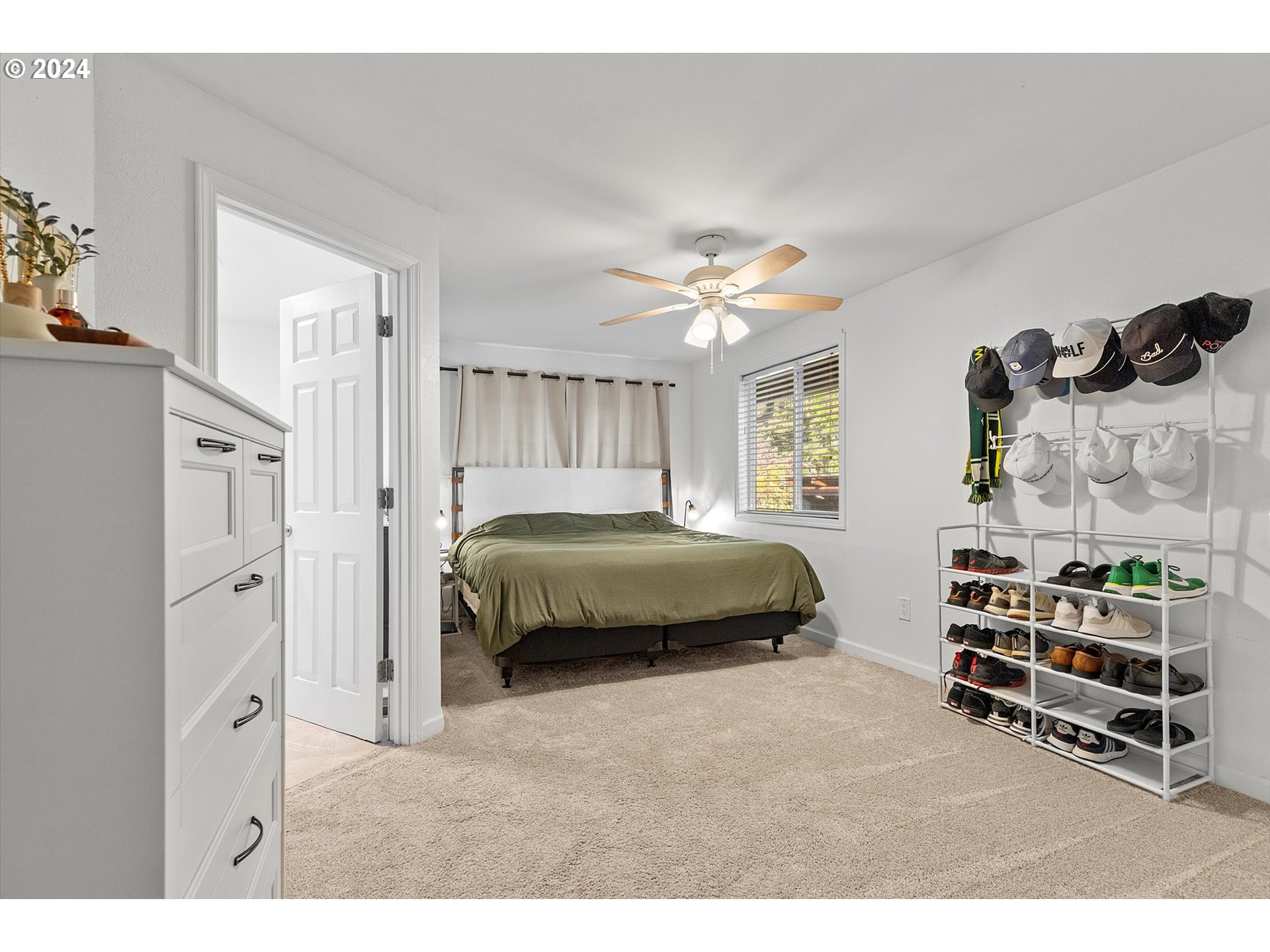 3825 Southeast 6th Street Gresham, OR 97080 - Photo 14 of 37 a bedroom with a bed and a window