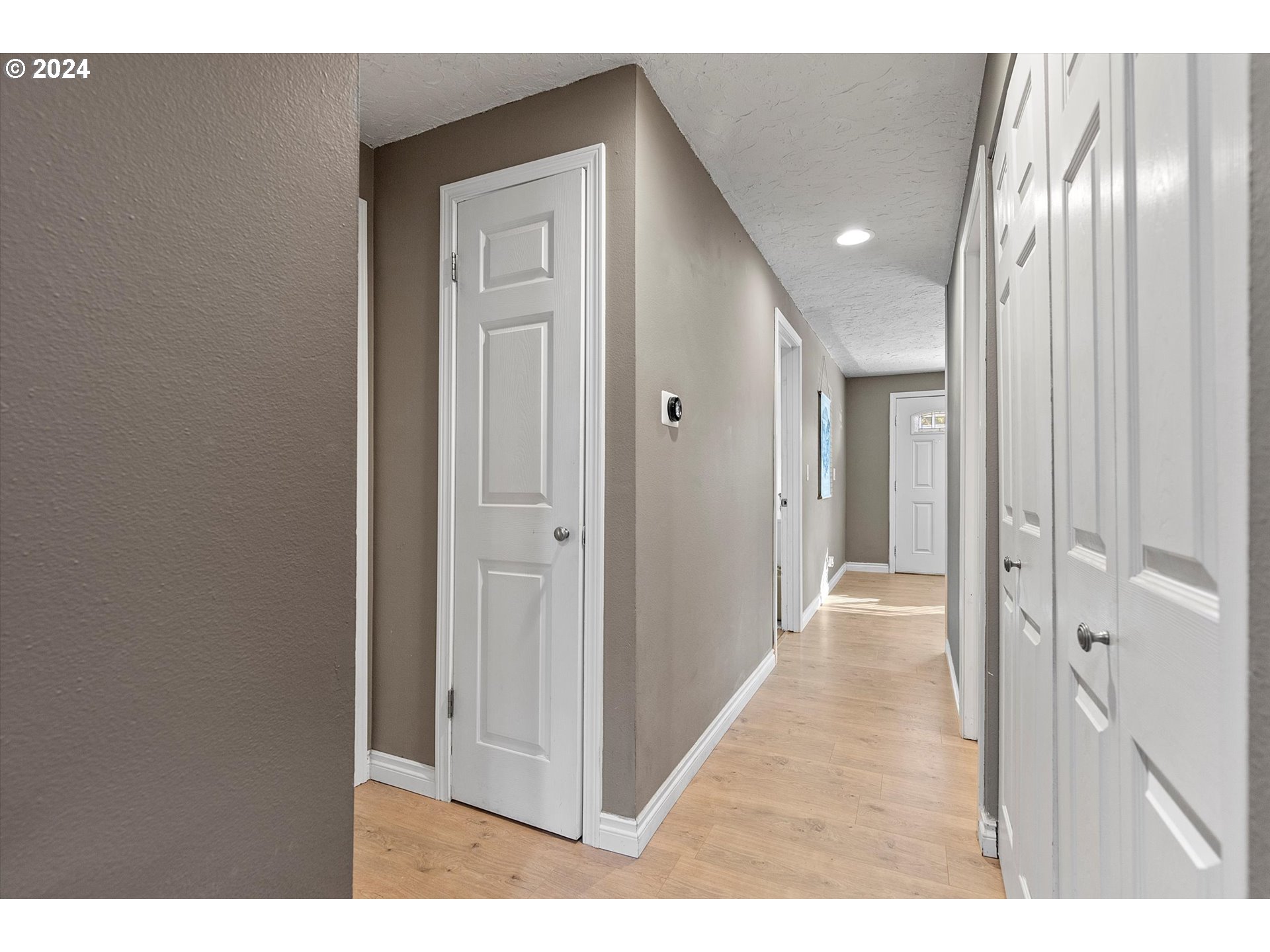 3825 Southeast 6th Street Gresham, OR 97080 - Photo 18 of 37 a view of a hallway with wooden floor
