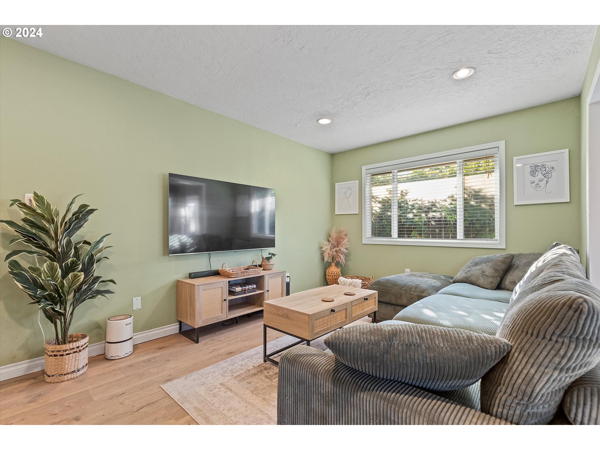 3825 Southeast 6th Street Gresham, OR 97080 - Photo 27 of 37 a living room with furniture and a flat screen tv