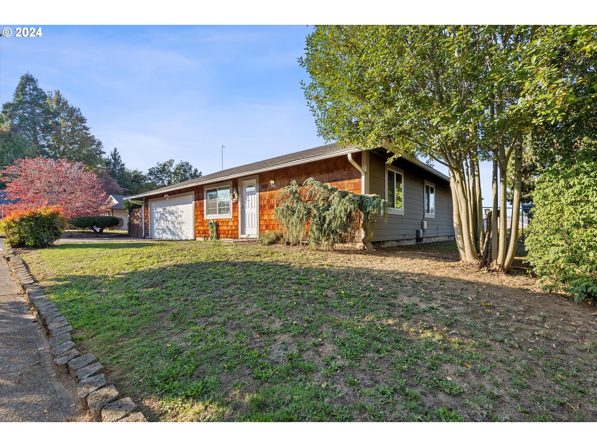 3825 Southeast 6th Street Gresham, OR 97080 - Photo 3 of 37 a front view of a house with garden