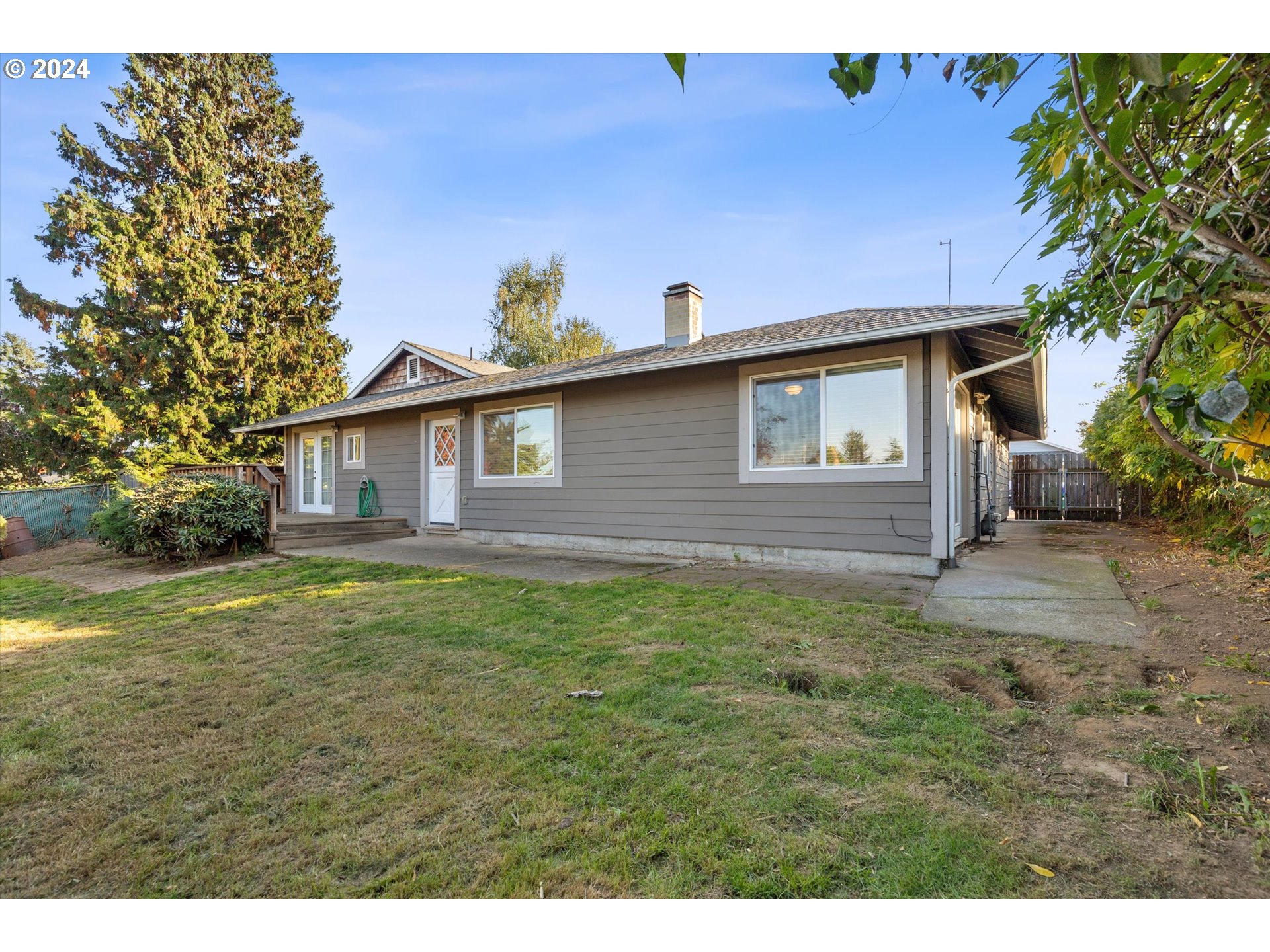 3825 Southeast 6th Street Gresham, OR 97080 - Photo 33 of 37 a view of a house with backyard and garden