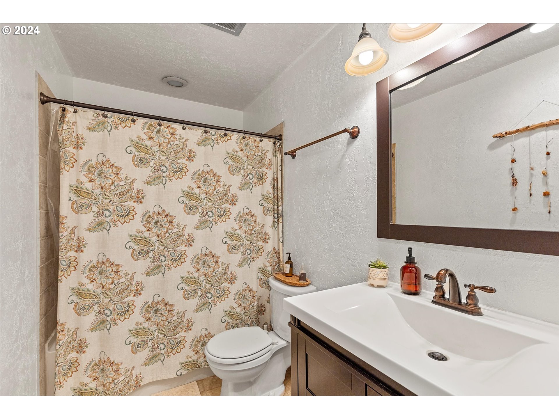 3825 Southeast 6th Street Gresham, OR 97080 - Photo 8 of 37 a bathroom with a sink toilet and shower