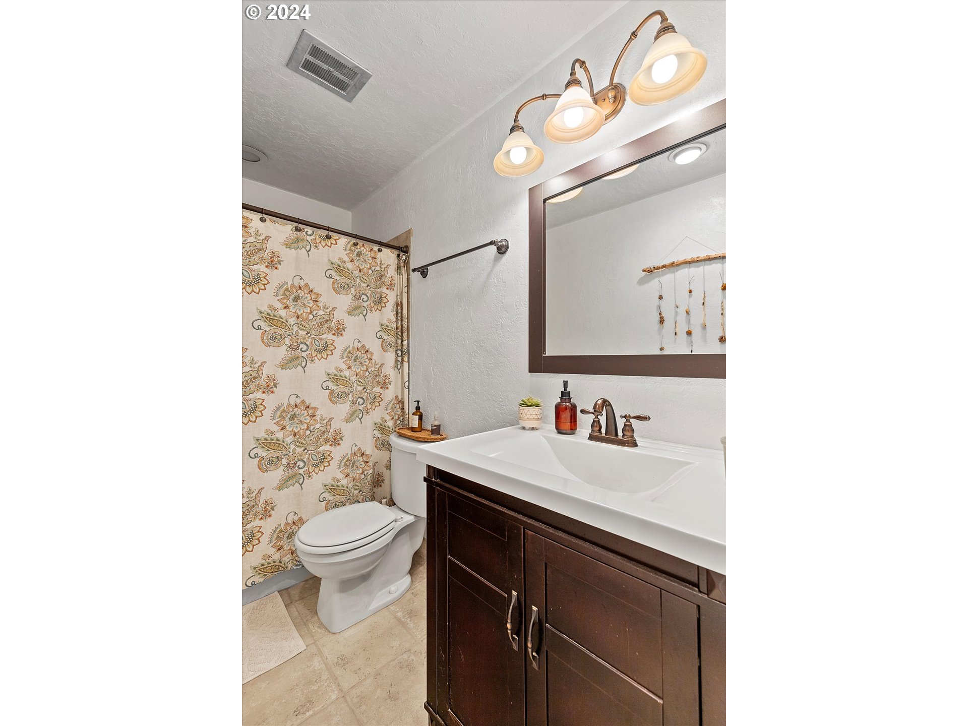 3825 Southeast 6th Street Gresham, OR 97080 - Photo 9 of 37 a bathroom with a sink a toilet and a mirror