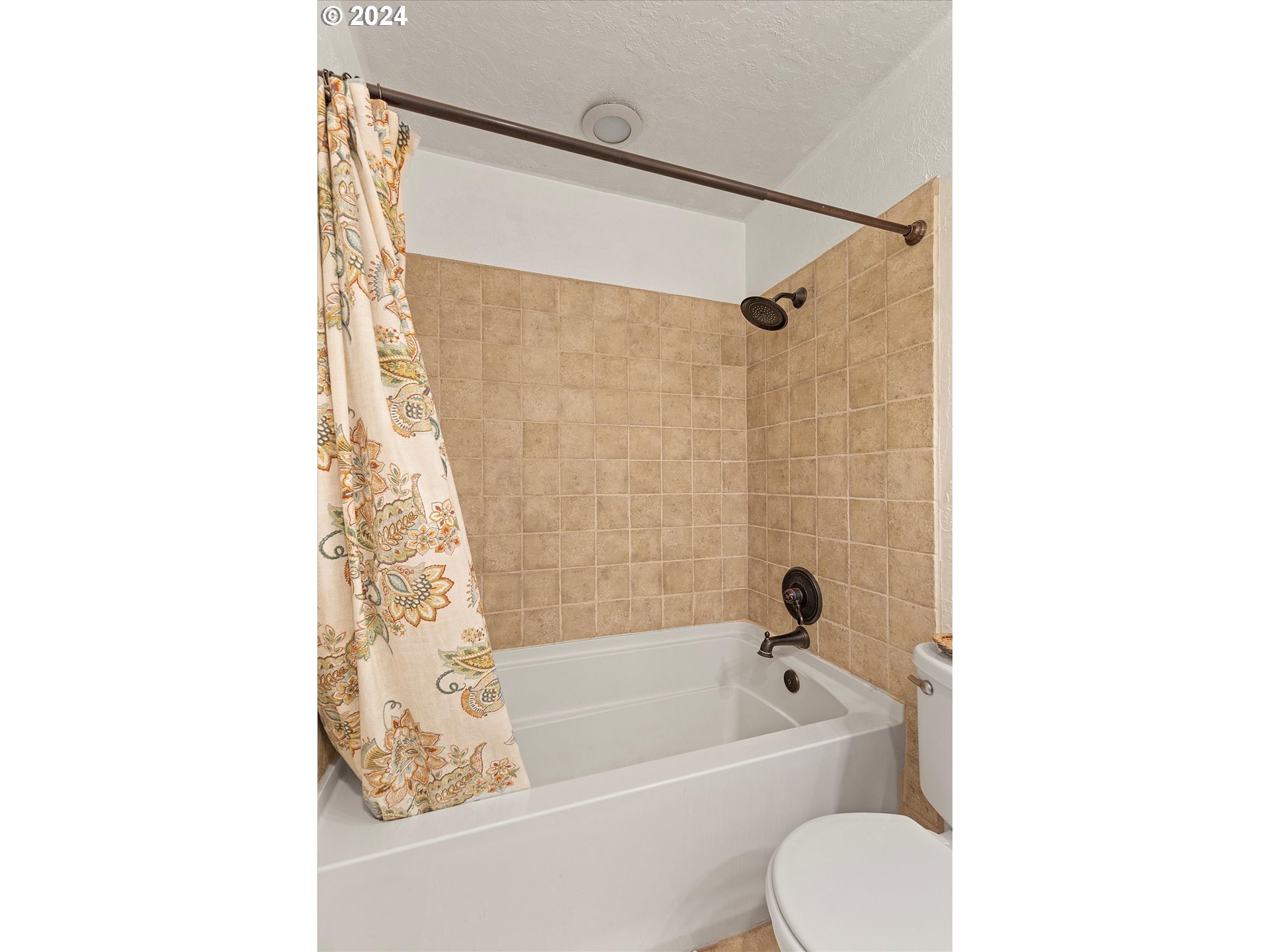 3825 Southeast 6th Street Gresham, OR 97080 - Photo 10 of 37 a bathroom with a toilet and a bathtub