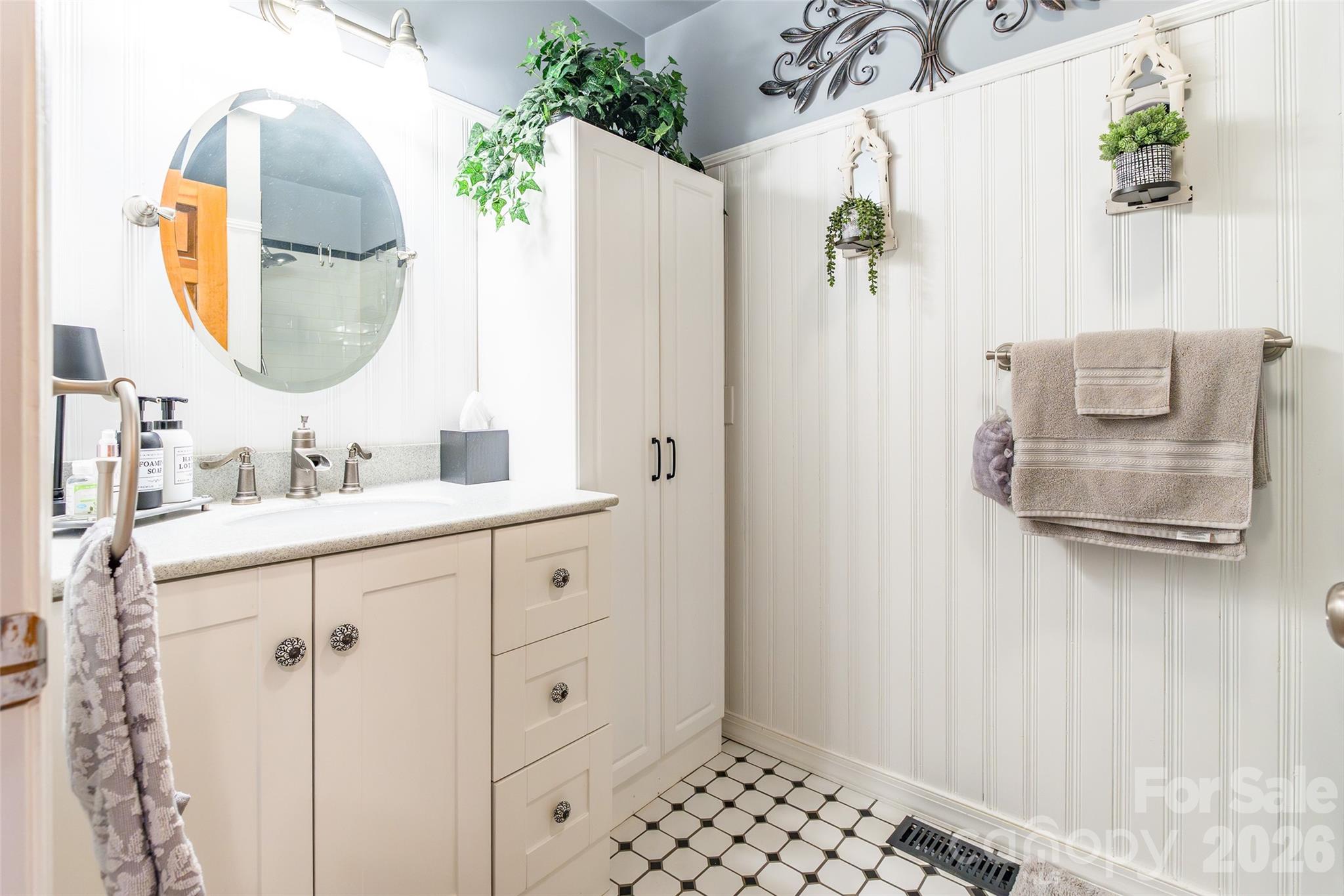 4205 Lake Shore Road South Denver, NC 28037 - Photo 19 of 46 a bathroom with a sink mirror and vanity