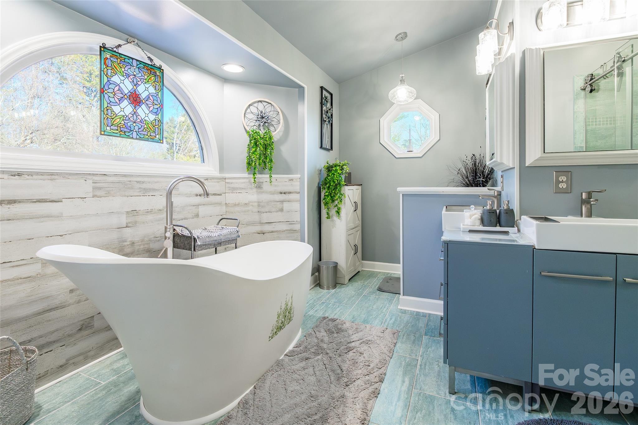 4205 Lake Shore Road South Denver, NC 28037 - Photo 24 of 46 a bathroom with a sink and a mirror