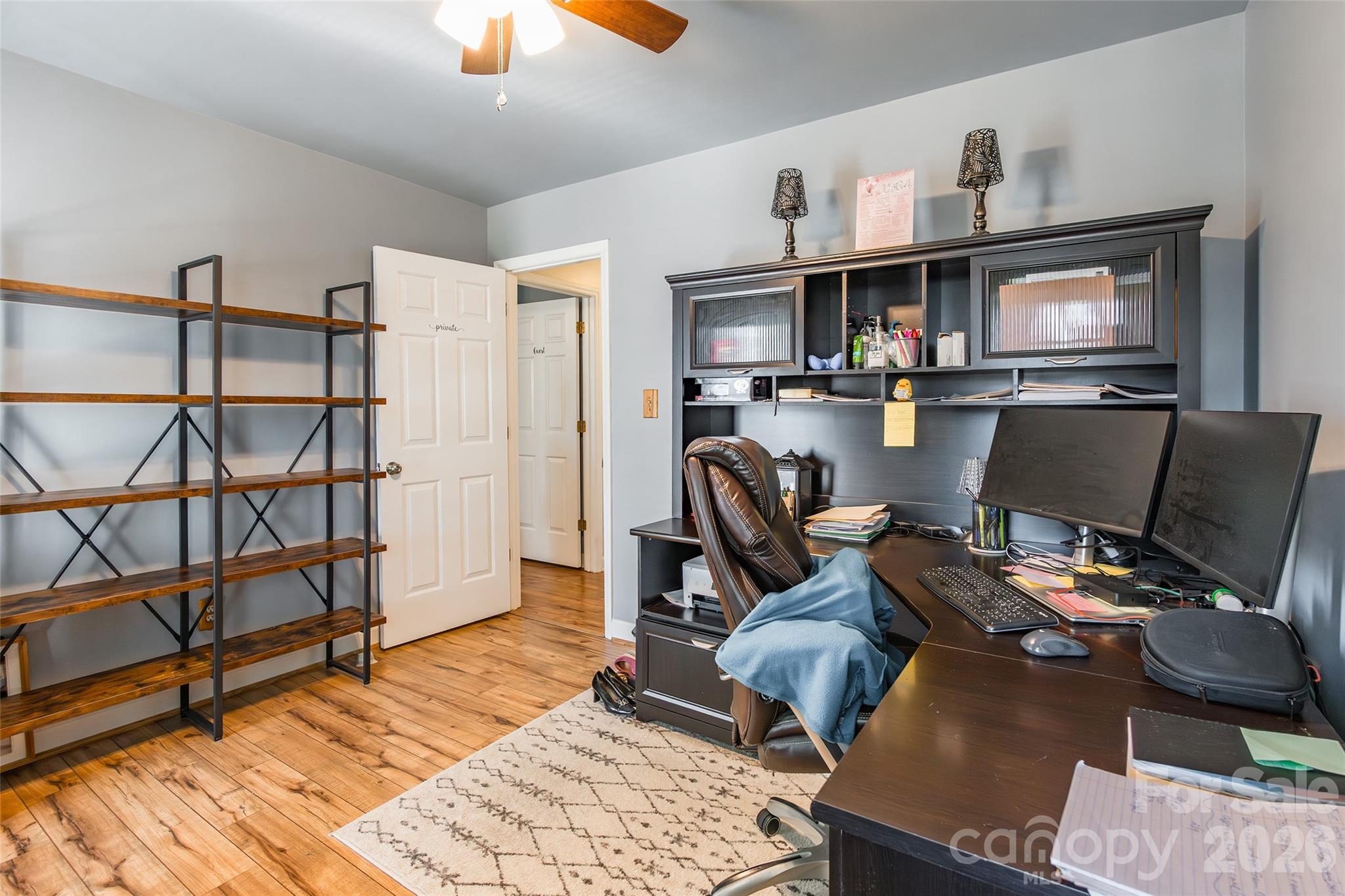 4205 Lake Shore Road South Denver, NC 28037 - Photo 29 of 46 a view of a workspace with furniture and a flat screen tv