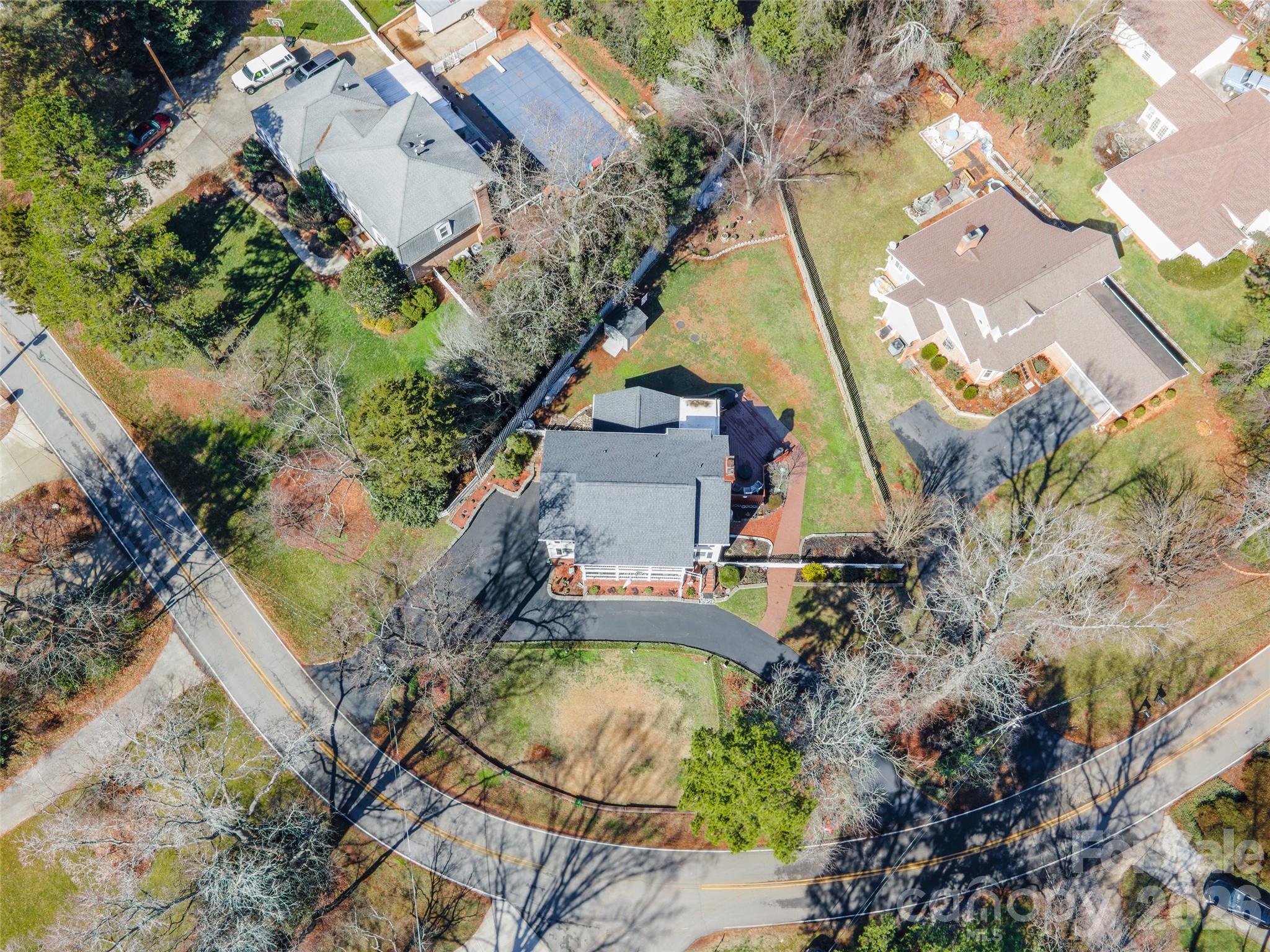 4205 Lake Shore Road South Denver, NC 28037 - Photo 45 of 46 an aerial view of a house with a yard and a large tree