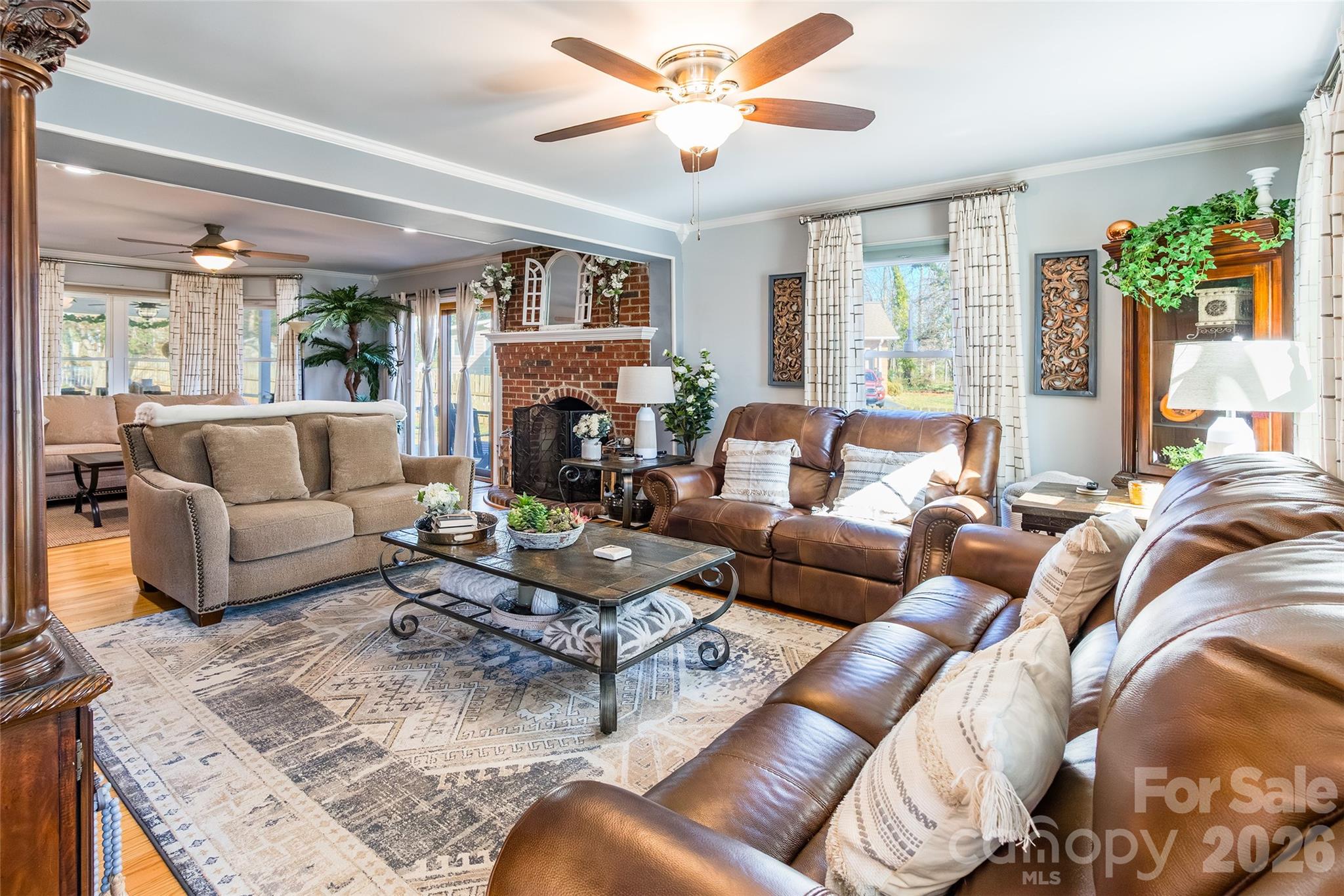 4205 Lake Shore Road South Denver, NC 28037 - Photo 7 of 46 a living room with furniture fireplace and a large window