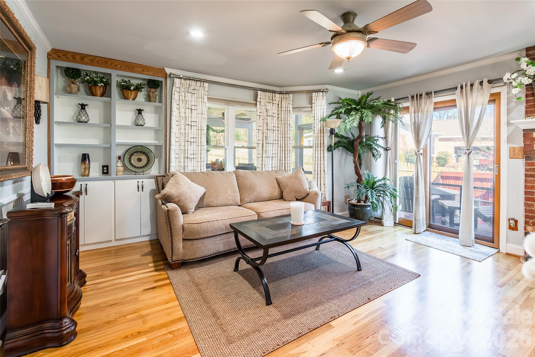 4205 Lake Shore Road South Denver, NC 28037 - Photo 9 of 46 a living room with furniture and a large window