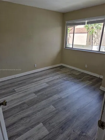 a bathroom with a sink vanity mirror and toilet