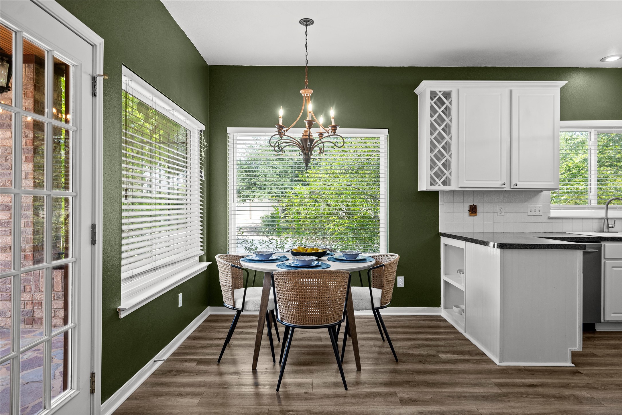 7000 Colberg Court Austin, TX 78749 - Photo 14 of 40 A well-lit breakfast area with durable flooring, featuring a kitchen island and abundant natural light.