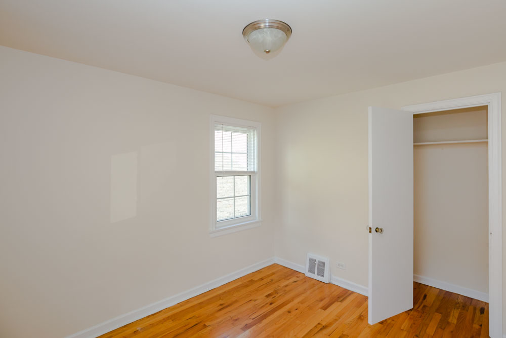 4245 West Nelson Street, Unit 1 Chicago, IL 60641 - Photo 6 of 8 a bedroom with bed and window