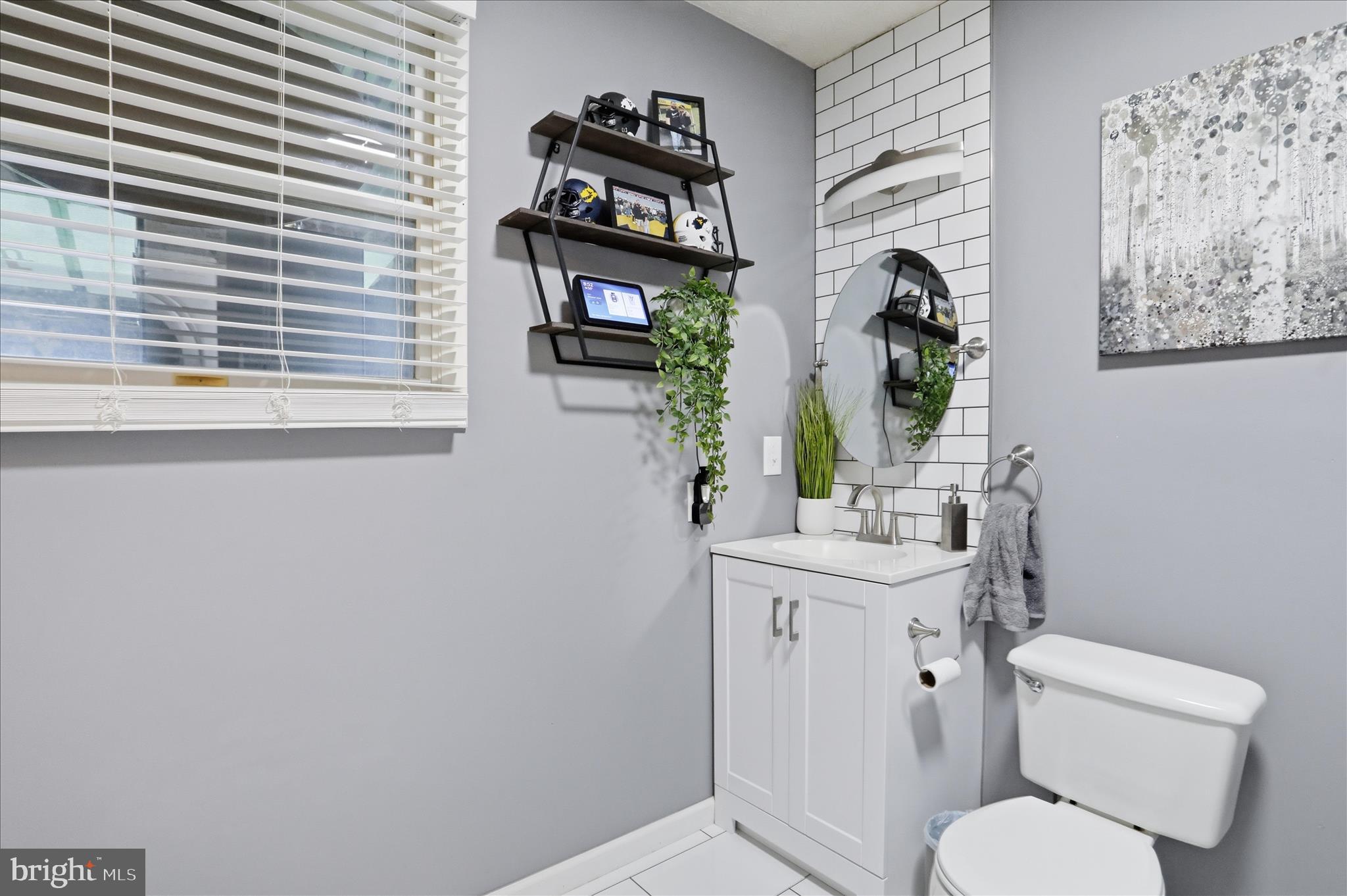 65 South Hummingbird Street Keyser, WV 26726 - Photo 15 of 30 a bathroom with a toilet sink and mirror
