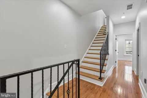 a view of entryway with wooden floor