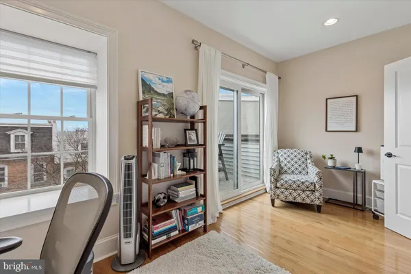 a bedroom with furniture and a window