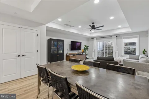 a view of a dining room with furniture window and wooden floor