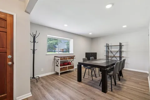 a view of a workspace with furniture and window