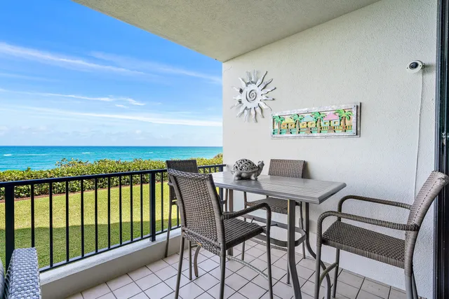a view of a balcony with chairs