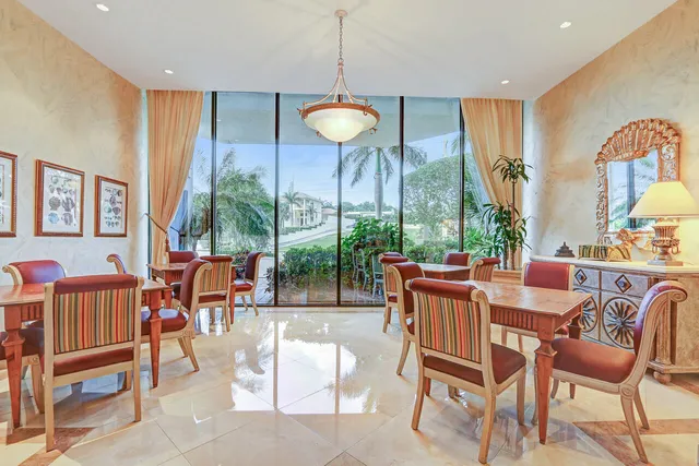 a view of a dining room with furniture window and outside view