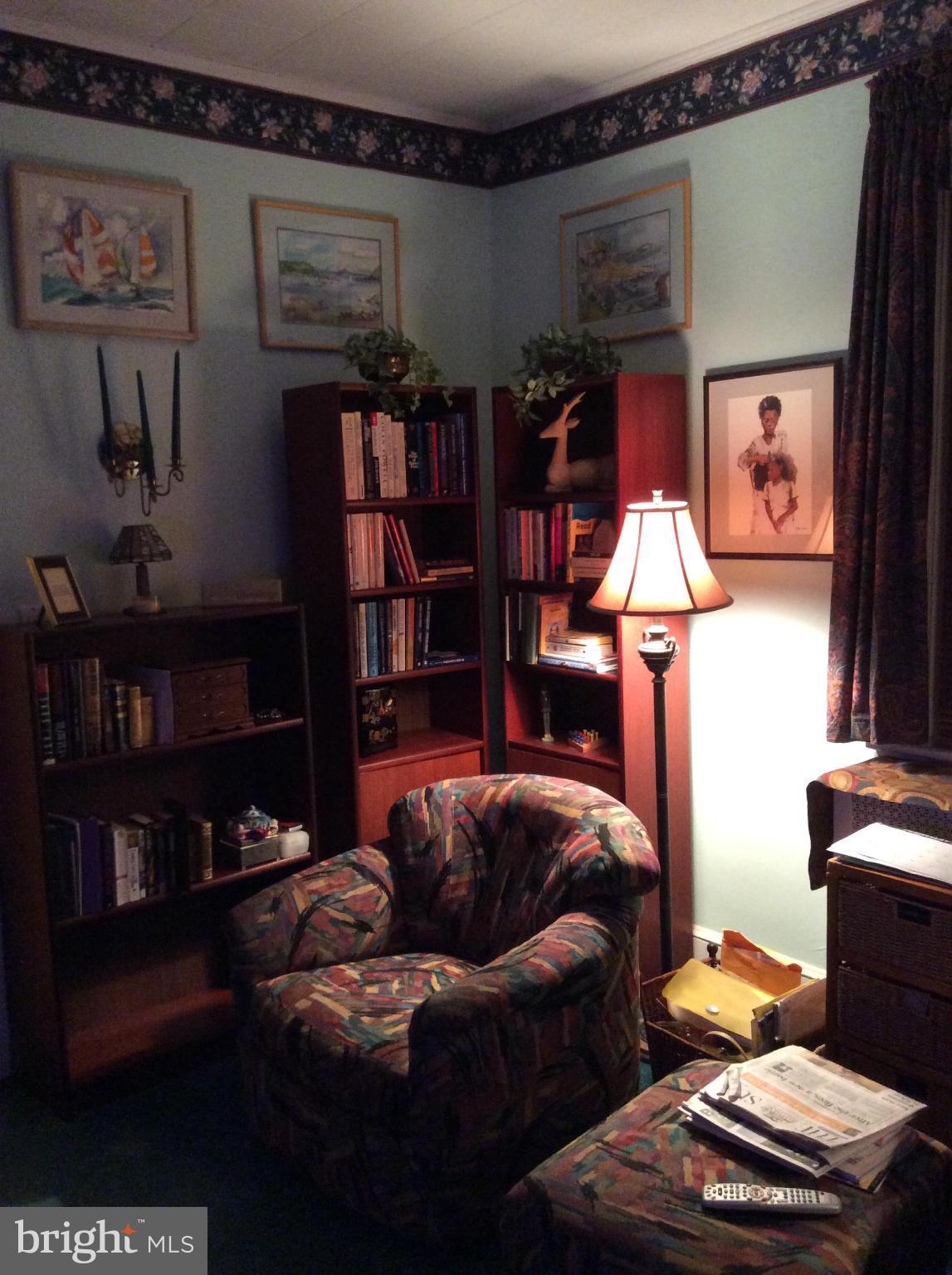2700 Allendale Road Baltimore, MD 21216 - Photo 11 of 30 a bedroom with furniture and a lamp
