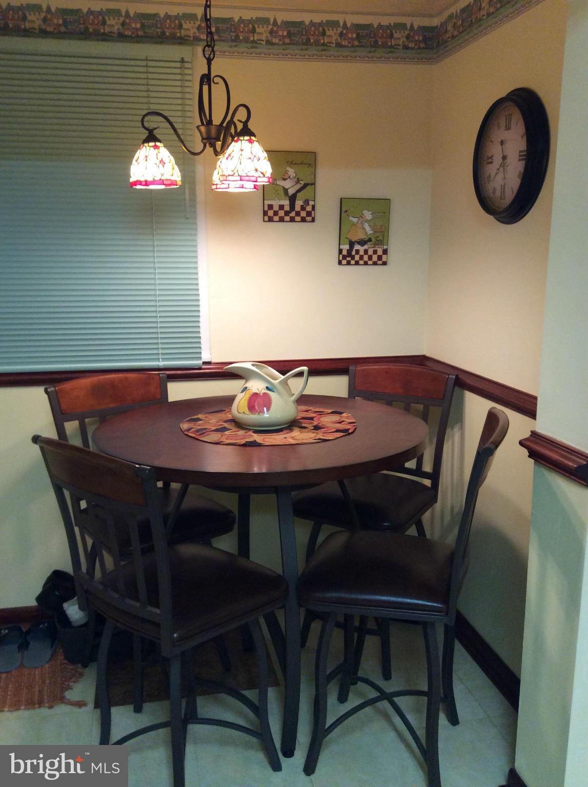 2700 Allendale Road Baltimore, MD 21216 - Photo 21 of 30 a view of a dining room with furniture and wooden floor