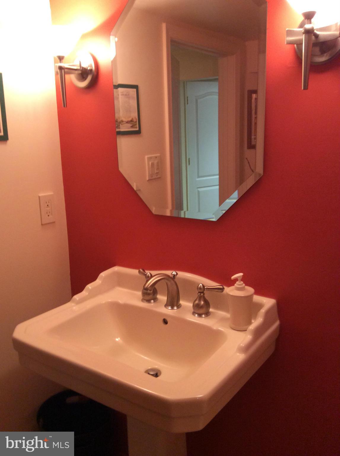 2700 Allendale Road Baltimore, MD 21216 - Photo 24 of 30 a bathroom with a sink and mirror