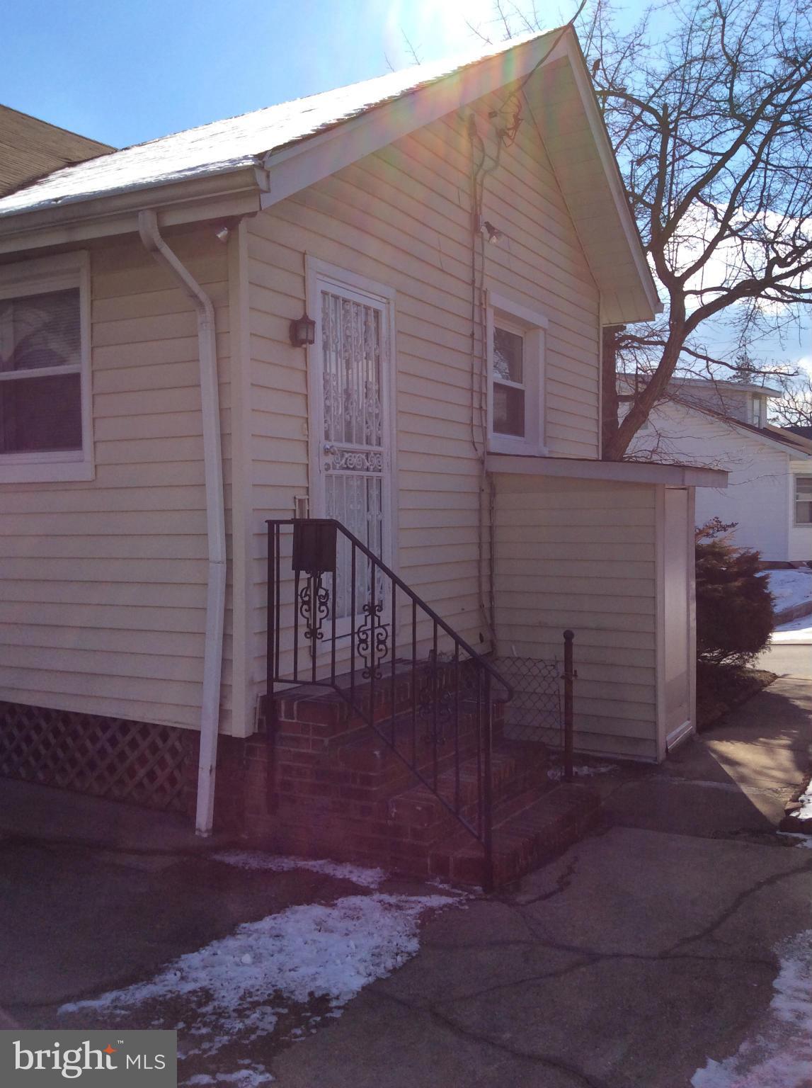 2700 Allendale Road Baltimore, MD 21216 - Photo 27 of 30 a front view of a house with a yard