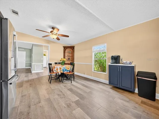 a view of a livingroom with furniture and a window