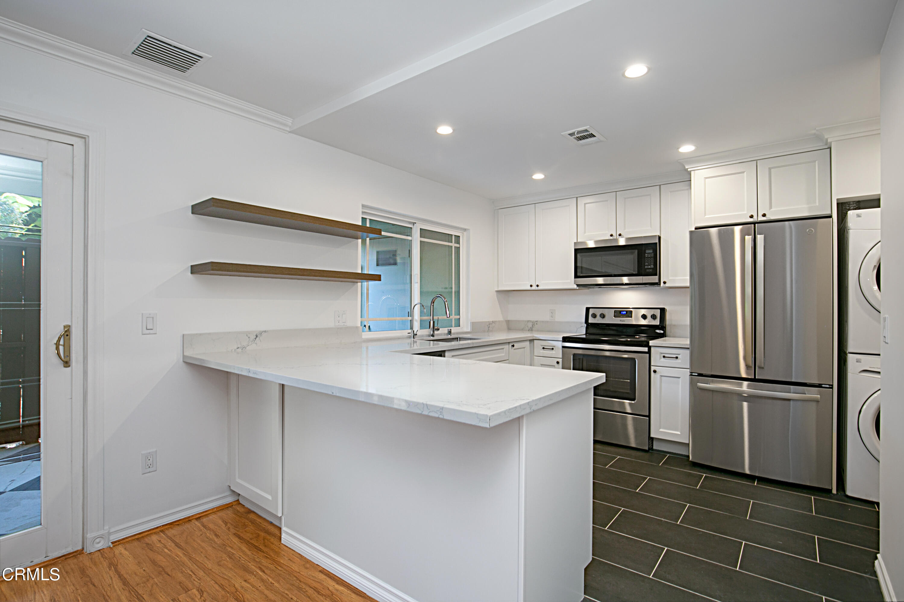 1429 Valley View Road, Unit 13 Glendale, CA 91202 - Photo 13 of 33 a kitchen with stainless steel appliances a refrigerator and a stove top oven