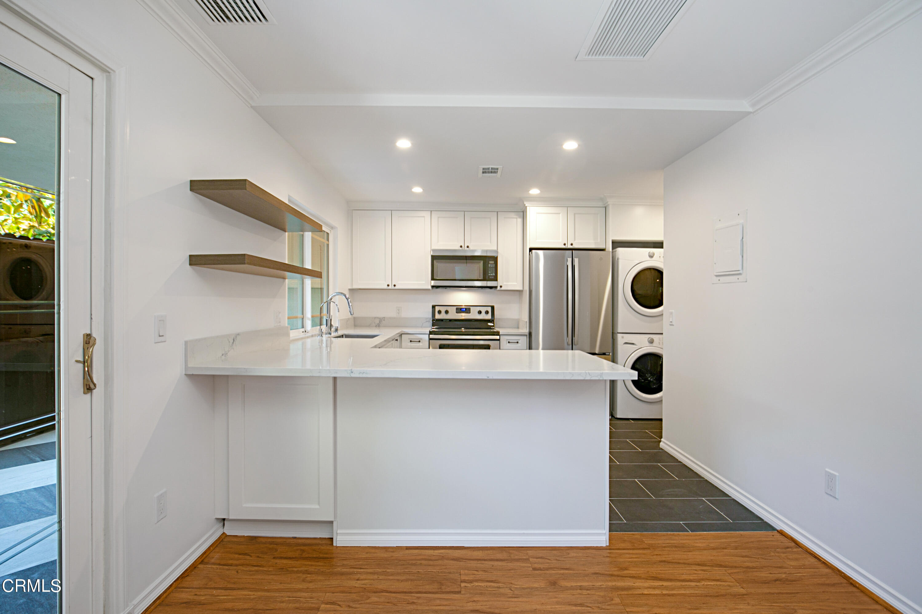 1429 Valley View Road, Unit 13 Glendale, CA 91202 - Photo 14 of 33 a kitchen with stainless steel appliances a refrigerator and a stove top oven