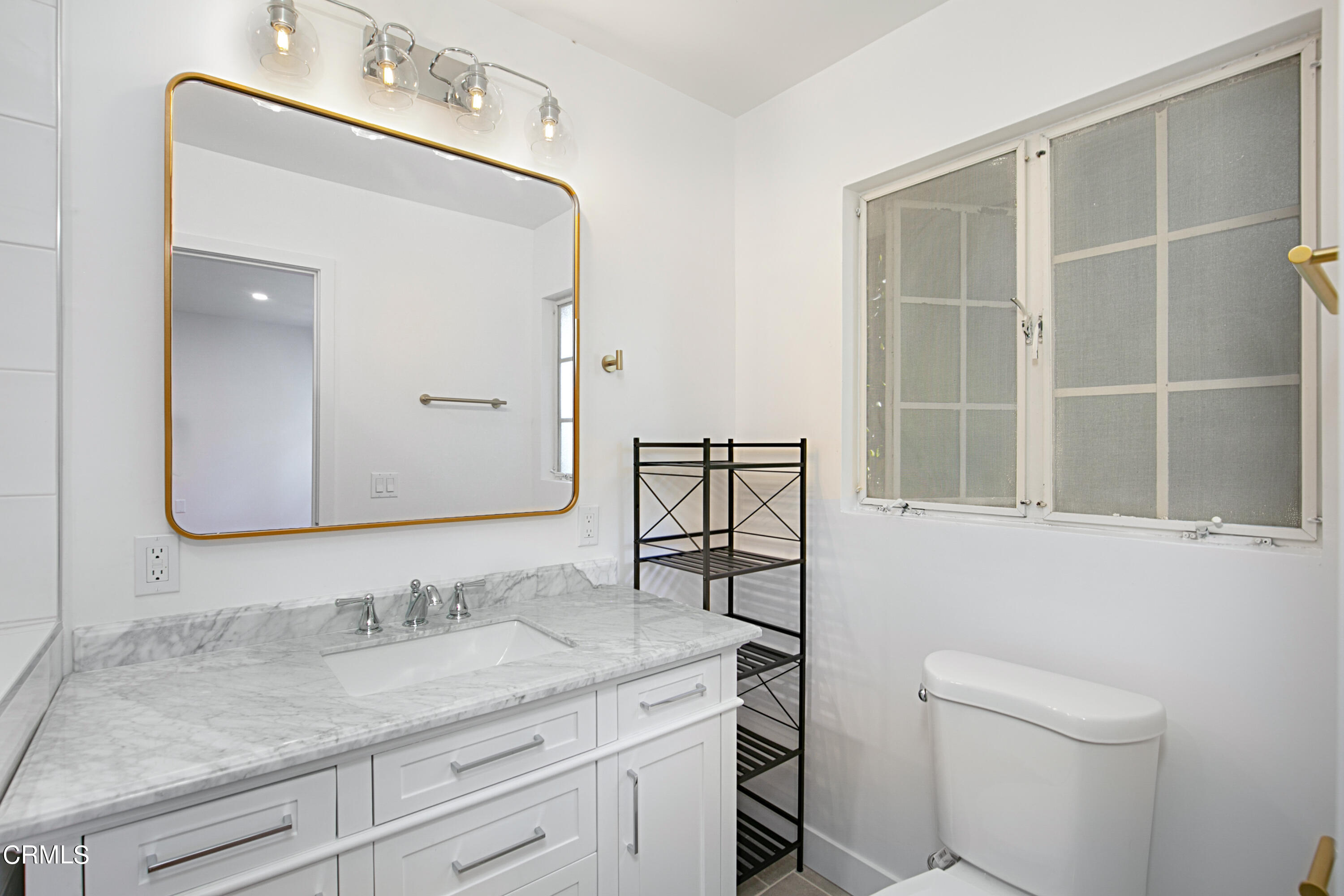 1429 Valley View Road, Unit 13 Glendale, CA 91202 - Photo 24 of 33 a bathroom with a granite countertop sink a toilet and a mirror