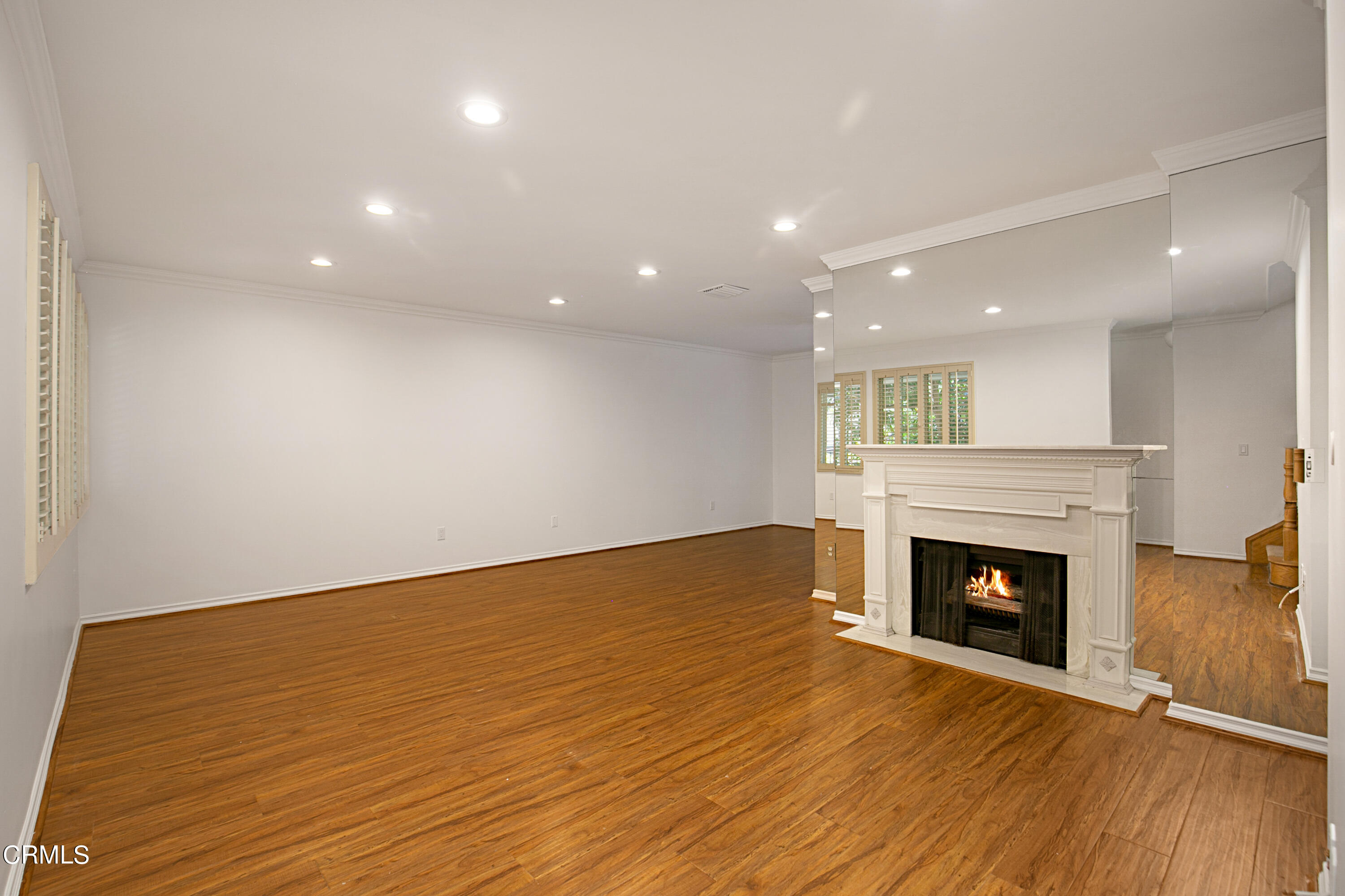 1429 Valley View Road, Unit 13 Glendale, CA 91202 - Photo 6 of 33 a view of an empty room with wooden floor and a fireplace