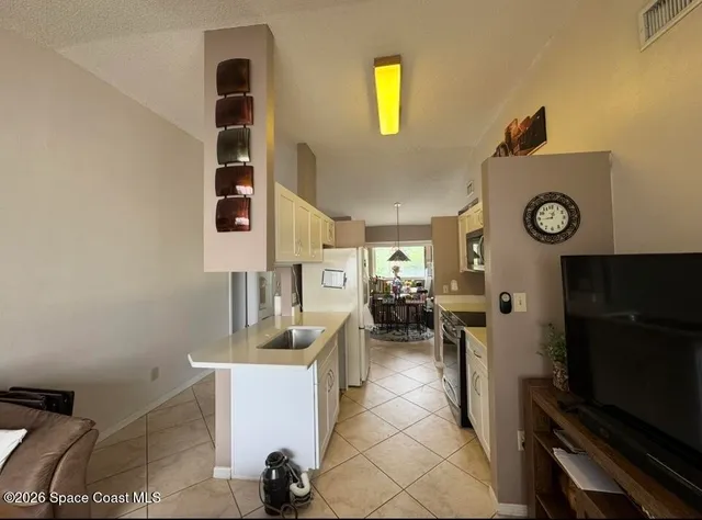 a view of living room with furniture and rug