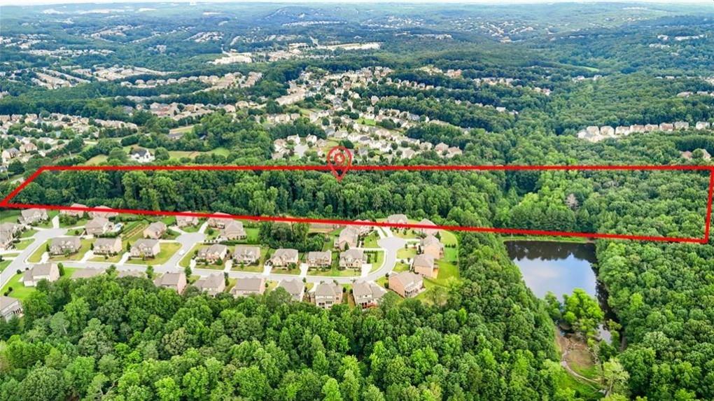 451 Nichols Drive Suwanee, GA 30024 - Photo 15 of 22 an aerial view of a houses with a yard and lake view