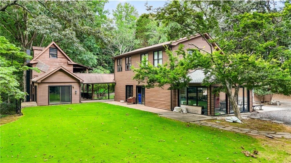 451 Nichols Drive Suwanee, GA 30024 - Photo 4 of 22 a front view of a house with a yard and tree