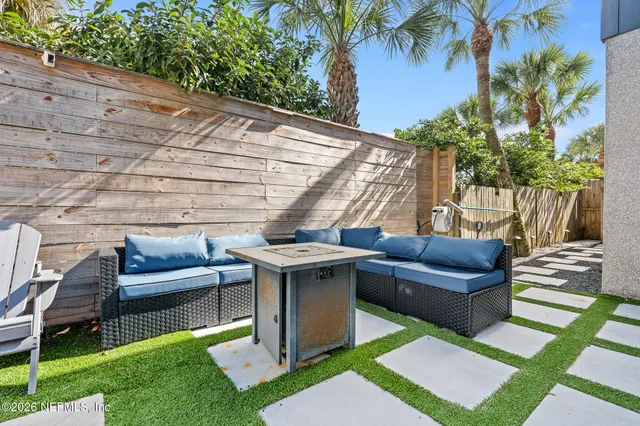 a large kitchen with stainless steel appliances kitchen island a large counter top a sink a stove and a refrigerator