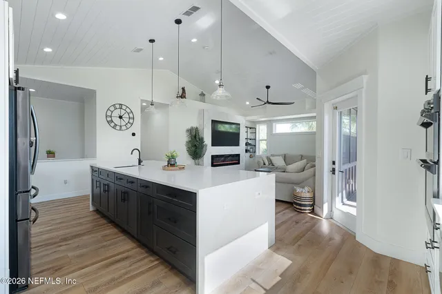 an aerial view of a house with a yard and garden