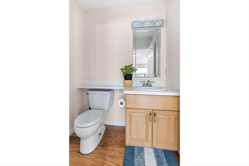 2 Arrowhead Circle, Unit 2 Ashland, MA 01721 - Photo 11 of 22 a bathroom with a toilet a sink and a mirror