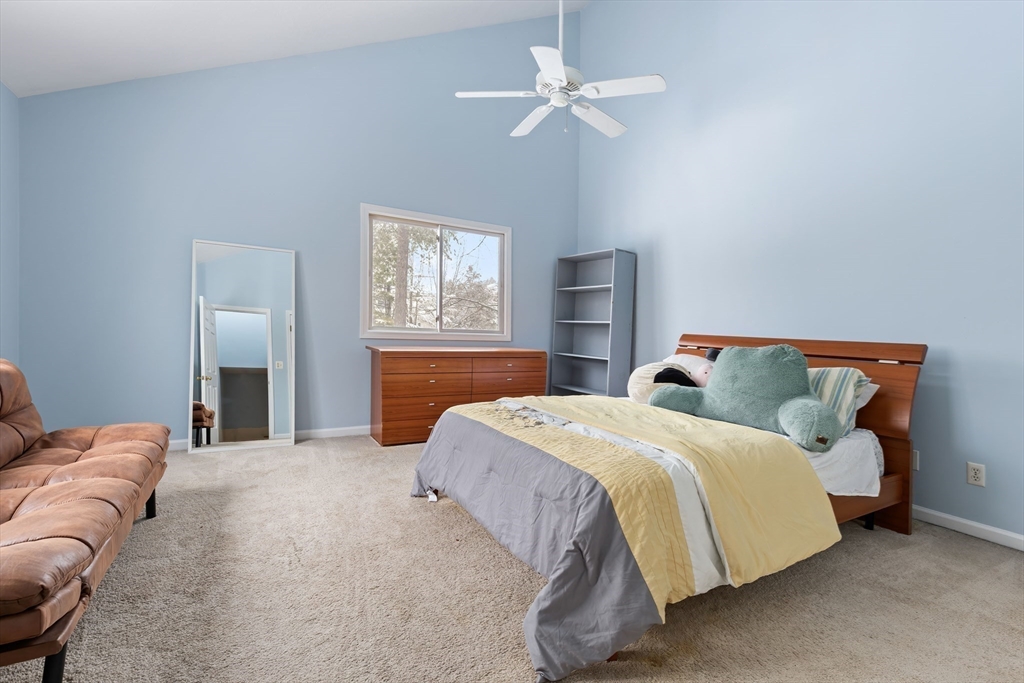 2 Arrowhead Circle, Unit 2 Ashland, MA 01721 - Photo 12 of 22 a bedroom with a bed chandelier and a window