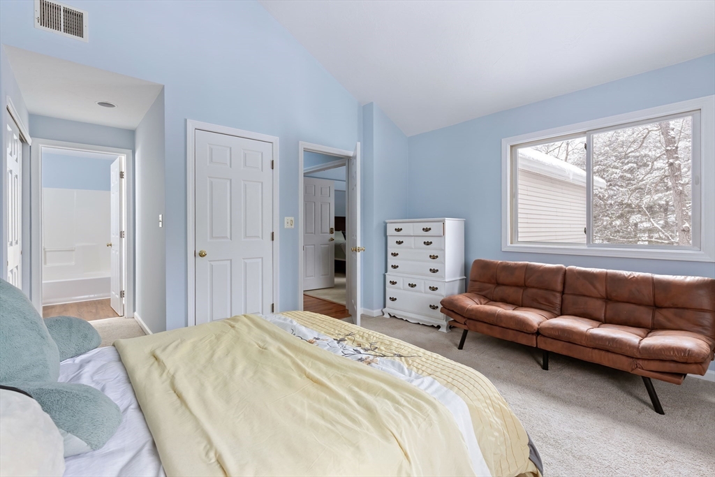 2 Arrowhead Circle, Unit 2 Ashland, MA 01721 - Photo 13 of 22 a bedroom with a bed couch and window