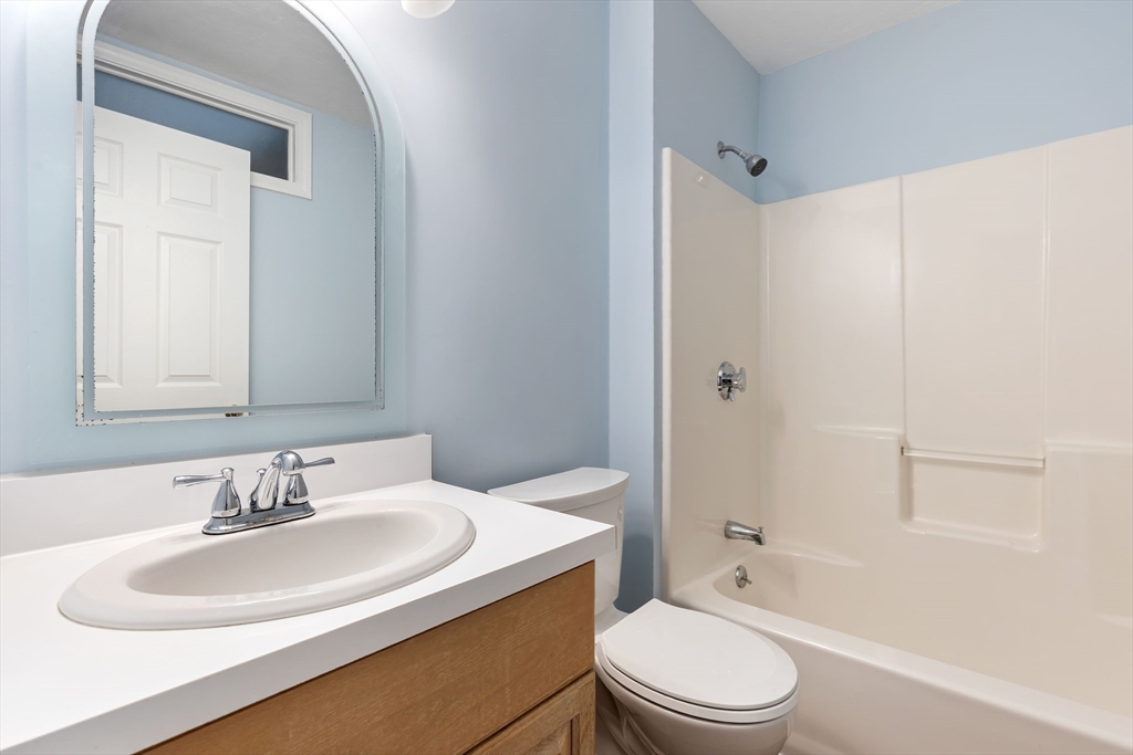 2 Arrowhead Circle, Unit 2 Ashland, MA 01721 - Photo 14 of 22 a bathroom with a sink toilet and shower