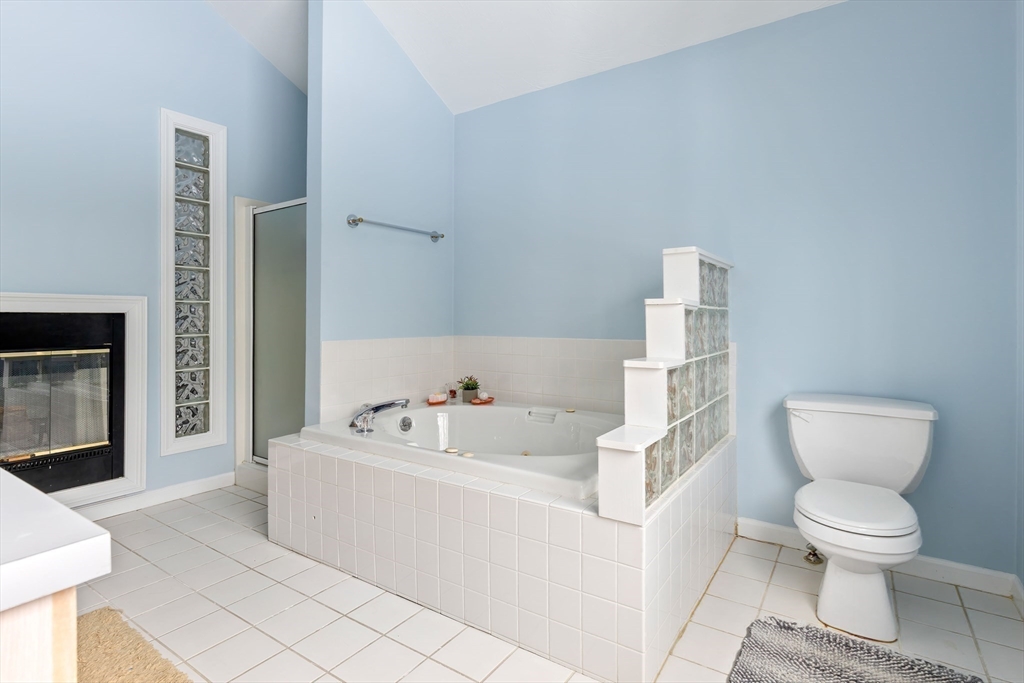 2 Arrowhead Circle, Unit 2 Ashland, MA 01721 - Photo 18 of 22 a white toilet sitting next to a bathroom sink