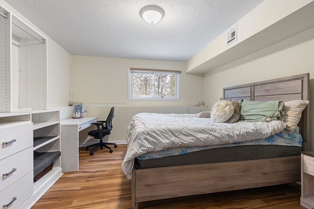 2 Arrowhead Circle, Unit 2 Ashland, MA 01721 - Photo 21 of 22 a bedroom with a bed and a desk